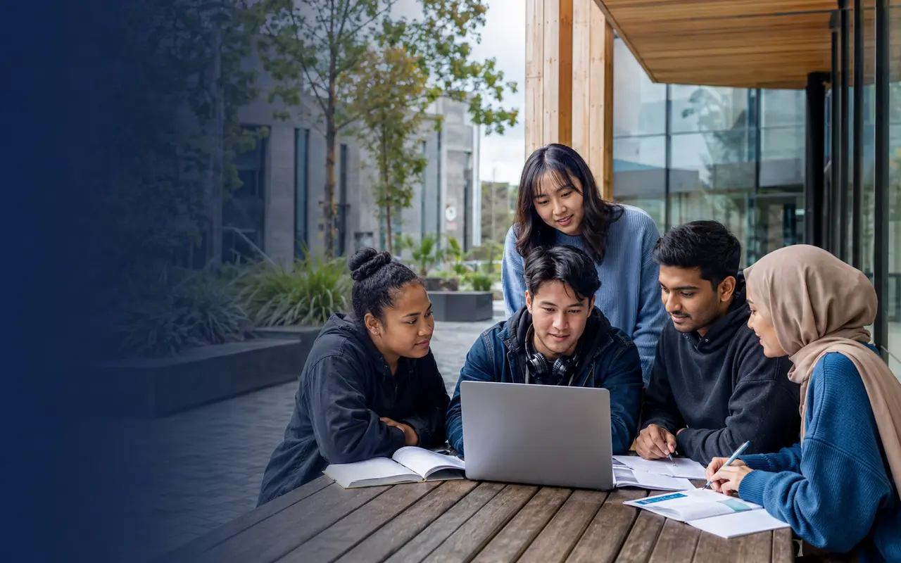 International students comparing study options on a New Zealand campus